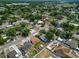 Aerial view of the home surrounded by lush greenery and residential streets in a neighborhood setting at 2301 Freemason St, Lakeland, FL 33801