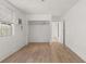 Bright bedroom with wood floors, white walls, closet, and windows for natural light at 2301 Freemason St, Lakeland, FL 33801
