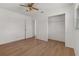 Bedroom with hardwood floors, a ceiling fan, closet, and natural light at 2301 Freemason St, Lakeland, FL 33801