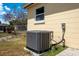 A new AC unit sits outside the house at 2301 Freemason St, Lakeland, FL 33801