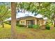 The exterior of the house showing backyard and manicured bushes at 2654 Rutledge Ct, Winter Haven, FL 33884