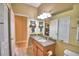 Comfortable bathroom featuring a combination shower-tub, large mirror, and neutral color palette at 2654 Rutledge Ct, Winter Haven, FL 33884