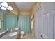 Standard bathroom featuring a shower-tub, neutral tile, and large mirror; a functional space at 2654 Rutledge Ct, Winter Haven, FL 33884