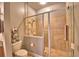 This well-lit bathroom showcases a glass shower enclosure and tiled shower with gray walls at 2654 Rutledge Ct, Winter Haven, FL 33884