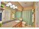 Bright bathroom with a large mirror, neutral countertops and a shower-tub combination at 2654 Rutledge Ct, Winter Haven, FL 33884