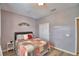 Comfortable bedroom featuring gray walls, wood flooring, and a double door closet at 2654 Rutledge Ct, Winter Haven, FL 33884