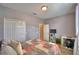 Bedroom featuring gray walls, wood floors, double door closet, and furniture with storage drawers at 2654 Rutledge Ct, Winter Haven, FL 33884