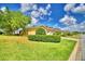 Charming townhome features manicured lawn, mature landscaping, and a brick paved driveway at 2654 Rutledge Ct, Winter Haven, FL 33884