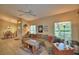 Inviting living room with tile floors, a ceiling fan, and comfortable seating for relaxing or entertaining at 2654 Rutledge Ct, Winter Haven, FL 33884