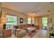 Cozy living room with a comfortable sofa, tile floors, and natural light at 2654 Rutledge Ct, Winter Haven, FL 33884