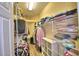 Walk-in closet with plenty of shelves and rods for storing clothes and other items at 2654 Rutledge Ct, Winter Haven, FL 33884
