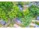 An aerial view showcasing lush trees in the surrounding neighborhood at 320 S Elm Rd, Lakeland, FL 33801