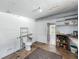 Unfinished basement area with a toilet, sink, and storage shelves offering potential for customization at 320 S Elm Rd, Lakeland, FL 33801