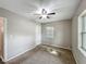 Bedroom featuring one window providing natural light, ceiling fan, and neutral carpet at 320 S Elm Rd, Lakeland, FL 33801