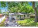 Charming single-story home with manicured front lawn and covered parking at 320 S Elm Rd, Lakeland, FL 33801