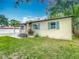 Image of the home's exterior showcasing its healthy green grass, exterior paint, and trim at 320 S Elm Rd, Lakeland, FL 33801