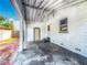 Covered back patio, providing ample space for outdoor seating and relaxation in a private setting at 320 S Elm Rd, Lakeland, FL 33801