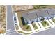 Bird's-eye view of a neighborhood featuring homes, sidewalks, and parked cars at 3265 Vesara Dr, Davenport, FL 33837