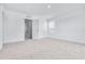 Bright bedroom with carpet, natural light, and a view into the hallway, bathroom, and walk-in closet at 3265 Vesara Dr, Davenport, FL 33837