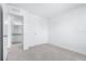 A bedroom with a closet, neutral carpeting, and access to the bathroom area at 3265 Vesara Dr, Davenport, FL 33837