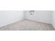 This bedroom features neutral carpeting, white walls, and a window for natural light at 3265 Vesara Dr, Davenport, FL 33837
