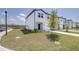 New construction townhome with green lawn and landscaping at 3265 Vesara Dr, Davenport, FL 33837