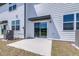A concrete patio with sliding glass door leading to an outdoor space and AC unit at 3265 Vesara Dr, Davenport, FL 33837