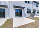 A white siding home has a concrete patio and sliding glass door at 3269 Vesara, Davenport, FL 33837