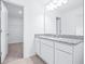 Bright bathroom with granite countertop and door to walk-in closet at 3269 Vesara, Davenport, FL 33837