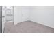 Bedroom with plush carpet, white walls leading to bath with granite vanity at 3269 Vesara, Davenport, FL 33837