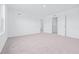 Bedroom with neutral carpet, white walls, and open doorway at 3269 Vesara, Davenport, FL 33837