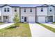 Charming townhome featuring a one-car garage and a well-maintained lawn at 3269 Vesara, Davenport, FL 33837