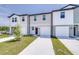 Attractive townhome showcases diverse facades and driveway leading to garage at 3269 Vesara, Davenport, FL 33837