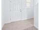 Bright foyer with white door, tile flooring, and pristine white walls at 3269 Vesara, Davenport, FL 33837