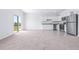 Bright living space with tile flooring by kitchen and large sliding glass door at 3269 Vesara, Davenport, FL 33837
