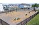 Community playground with swings, see-saw, and slide in a fenced-in area at 3269 Vesara, Davenport, FL 33837
