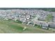 An aerial view of homes in a well-planned community, showcasing a desirable and Gathering-friendly neighborhood at 3862 Whitney Way, Haines City, FL 33844