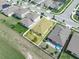Aerial view of a charming home, featuring a well-maintained lawn and a cozy pergola in the fenced backyard at 3862 Whitney Way, Haines City, FL 33844