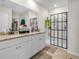 Bright bathroom with double vanity, granite countertop, walk-in shower, and modern finishes at 3862 Whitney Way, Haines City, FL 33844