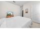 Bedroom features a large bed, a television, and neutral walls with white trim at 3862 Whitney Way, Haines City, FL 33844