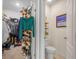 Features of a walk-in closet and toilet room with ample clothing storage, shelving, and natural light at 3862 Whitney Way, Haines City, FL 33844