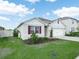 Charming single-story home with well-manicured lawn and inviting curb appeal at 3862 Whitney Way, Haines City, FL 33844