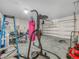 Garage featuring a punching bag, various tools, and a ladder at 3862 Whitney Way, Haines City, FL 33844