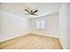 Bright bedroom with laminate flooring and a window with light-filtering shutters at 409 Greenfield Rd, Winter Haven, FL 33884