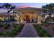 Stately clubhouse entrance with well-manicured landscaping and elegant lighting fixtures at 409 Greenfield Rd, Winter Haven, FL 33884