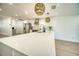 Modern kitchen with new countertops, stainless steel appliances, wood floors and stylish lighting at 409 Greenfield Rd, Winter Haven, FL 33884