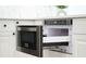 Close up of a stainless steel drawer style microwave, open to reveal the interior at 409 Greenfield Rd, Winter Haven, FL 33884
