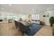 Spacious open-concept living area with hardwood floors, kitchen, and bright windows at 409 Greenfield Rd, Winter Haven, FL 33884