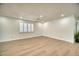 Spacious living room with new floors, a window with shutters and recessed lighting at 409 Greenfield Rd, Winter Haven, FL 33884