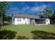 Spacious backyard featuring a screened-in porch and well-maintained lawn, great for outdoor enjoyment at 420 N 5Th St, Lake Wales, FL 33853